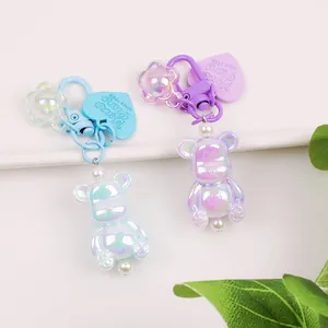 Luminous polar bear keychains in blue and purple with heart charm and pearl accents