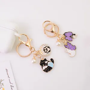 Cartoon alloy cat keychain with enamel star moon pendants and gold-tone lobster clasp