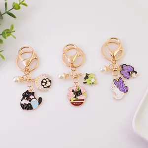 Cat themed enamel keychains with star cat claw and pearl charms on gold alloy ring