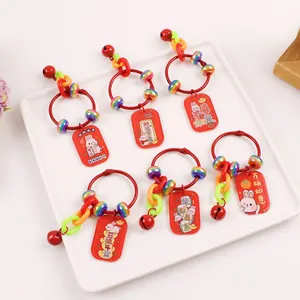 Red rabbit keychains with lucky charms and traditional Chinese character pendants
