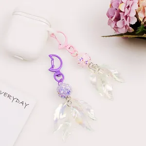 Iridescent leaf keychain with beads and moon clasp in pink and white for bags