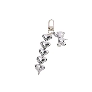 Silver metallic heart pendant with cute bear charm and lobster clasp for bags and keys