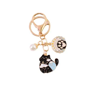 Cartoon cat keychain with gold star and moon enamel charms and white pearl pendant