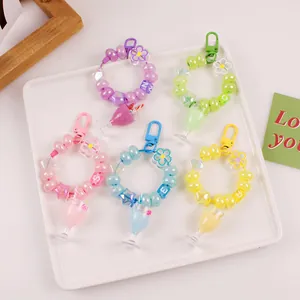 Colorful bubble tea cup keychains with letter beads and star charms in various vibrant colors