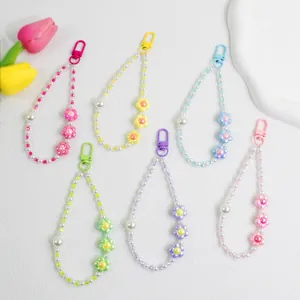 Close-up of colorful flower pearl beaded keychains in six pastel shades for bags