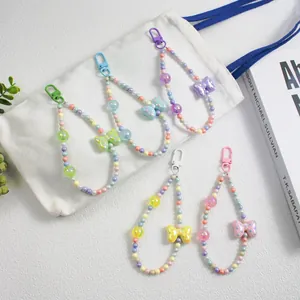 Colorful beaded keychain straps with polka dot bows in five vibrant pastel color options