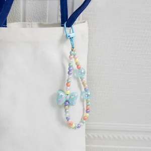 Colorful beaded charm with polka dot bow and lobster clasp for bags and keys