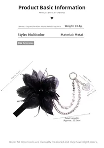 Detail view of a black tulle feather keychain with pearls and heart charm measurements