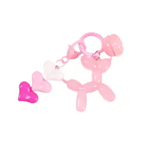 Pink jelly balloon dog keychain with heart gradient charm and metal bell for bags