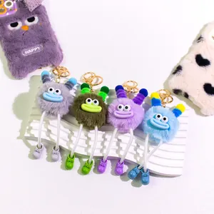 Set of four colorful plush monster keychains with funny long legs and boots