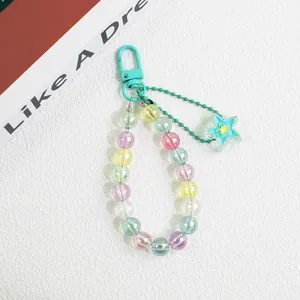 Detail of colorful acrylic beads and star pendant on a vibrant keychain charm