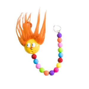 Cute yellow fuzzy keychain with colorful beaded chain and orange hair for bags