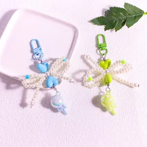 Lollipop bow keychain with faux pearls and heart beads for bags and car keys