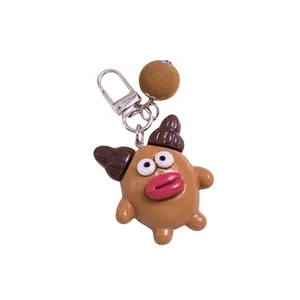Porte-clés de personnage de dessin animé avec lèvres rouges et boule en peluche marron
