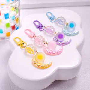 Cute cartoon cloud and moon keychain set in pastel blue purple pink and yellow colors