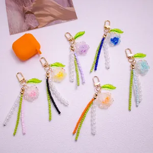 Portachiavi con Perline a Forma di Fiore di Camelia Pendente per Borsa in Resina per Donna Ragazza Stile Coreano con Nappa di Perline Accessorio