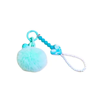 Cyan pom-pom beaded keychain with heart charm and bell for phones and bags decoration