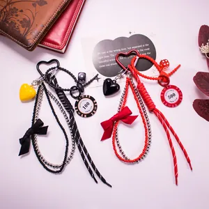 Handmade woven heart keychain with Monte Carlo poker chips and bows in red and black