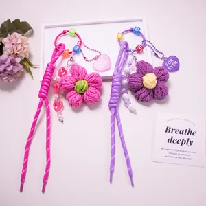 Handmade crochet flower keychain with acrylic letter beads and heart charm pendants