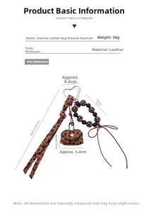 Detailed view of leopard print leather mini pouch keychain with beaded wristlet strap