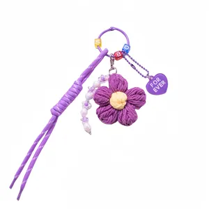Handmade purple crochet flower keychain with acrylic beads and heart charm accessory