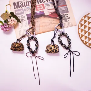 Leopard print leather coin purse keychain with heart carabiner and beaded tassel charm