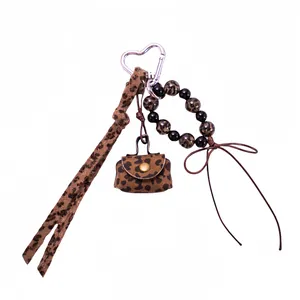Leopard print keychain set with heart clip mini bag and beaded charm for handbags