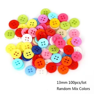 Macro view of 13mm assorted colorful four-hole resin buttons for sewing and DIY crafts