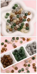 Macro detail of assorted marble texture acrylic beads in star-shaped and sorting trays