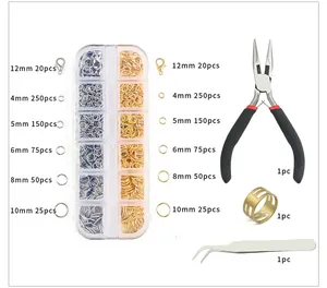 Detail view of 12-grid DIY jewelry making kit with lobster clasps, jump rings and pliers