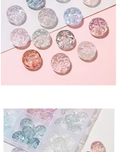 Macro detail of assorted pastel glass beads with spiral relief in a clear storage box
