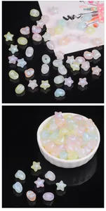 Iridescent acrylic star and heart beads in macaron colors displayed in a ceramic bowl
