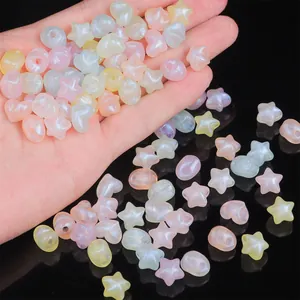Colorful macaron acrylic beads in star and heart shapes with a pearlescent finish
