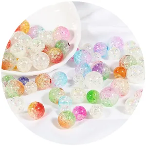 Colorful iridescent crackle acrylic beads for DIY jewelry making in a white ceramic dish