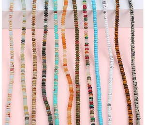 Detailed view of various natural stone saucer beads arranged in colorful vertical rows