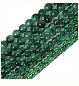 Macro shot of natural green chalcedony beads in various sizes for DIY jewelry making