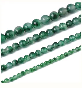 Detailed view of natural green stone beads in four sizes for jewelry making