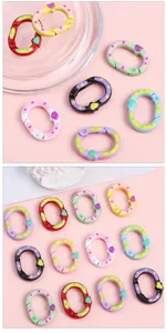 Close-up of heart-shaped spring rings with polka dots for DIY jewelry making