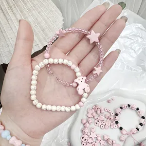 Macro view of pink synthetic turquoise cube beads and marble white DIY bracelet beads