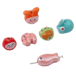DIY ceramic animal beads set featuring colorful elephant and fish for jewelry making