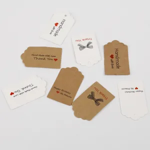 Assorted white and kraft paper gift tags with 'Handmade with love' and 'Thank You' text
