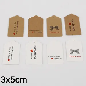Assorted paper gift tags with Handmade and Thank You prints for jewelry packaging