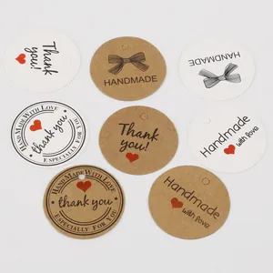 Round kraft and white gift tags with Thank You prints and pre-punched holes