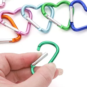 Colorful heart-shaped aluminum carabiners in various shades with spring gate closure