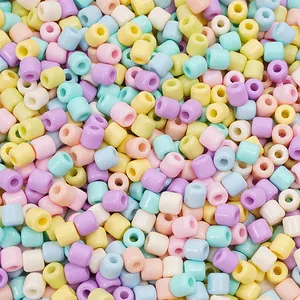 Macro view of colorful 6mm macaron barrel beads for handmade DIY jewelry making projects