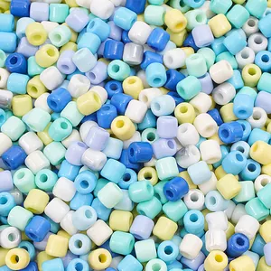 Macro view of macaron colored 6x6mm glass barrel beads for DIY jewelry making and crafts