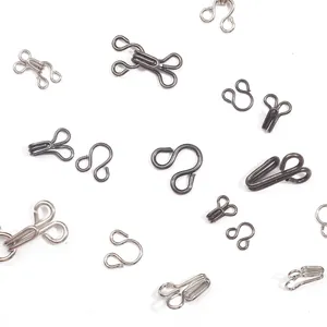 Corchetes metálicos invisibles para costura artesanal en acabados negro y plata brillo