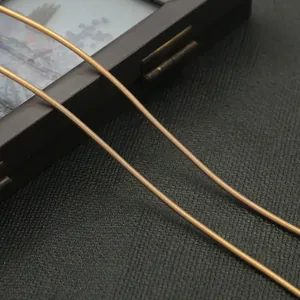 Macro shot of 1.8mm bronze spiral metal spring wire for DIY jewelry and hairpins