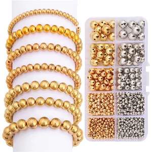 Gouden en zilveren DIY kralenset met diverse maten en kralenarmbanden in een doos
