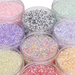 Macro shot of colorful iridescent 2-4mm glass seed beads in round plastic jars for DIY crafts